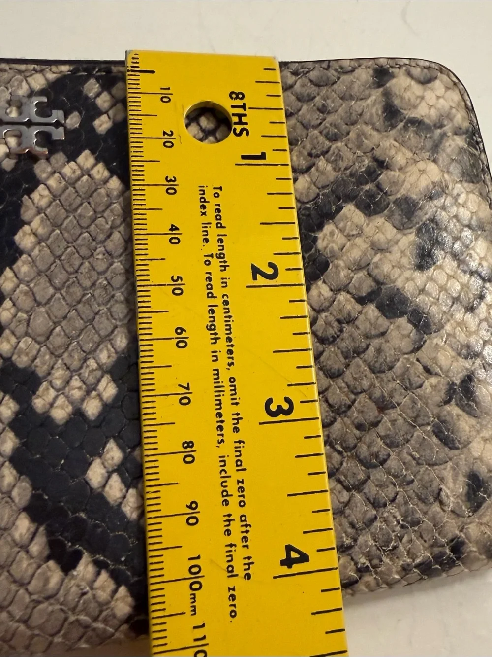 Tory Burch zip around continental wallet with snakeskin.